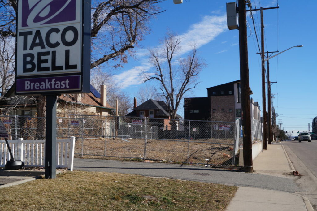 A sign on the fence at 3805 N. Newton St. indicates Stultz Homes will develop the site. The company’s website says condos are planned for December 2024. Photo by Kathryn White